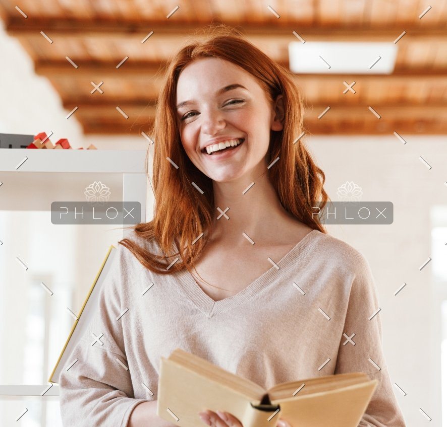 demo-attachment-445-happy-redhead-young-lady-student-reading-book-M5Z7RVC@2x-1